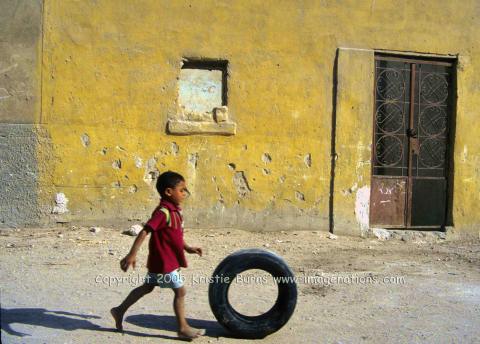 Boy and tire in Cairo Cemetary CR